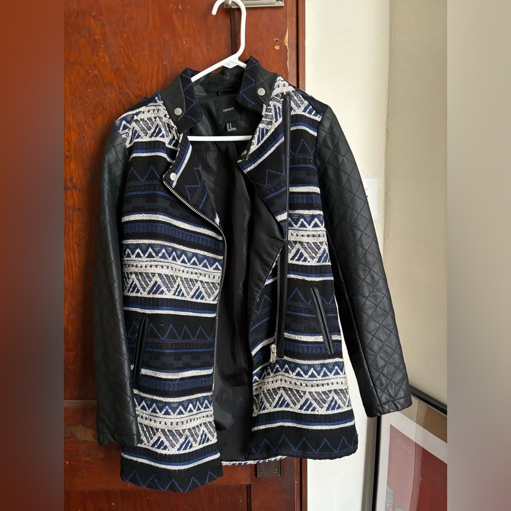 Really nice and detailed fall jacket. Leather sleeves. Button details.